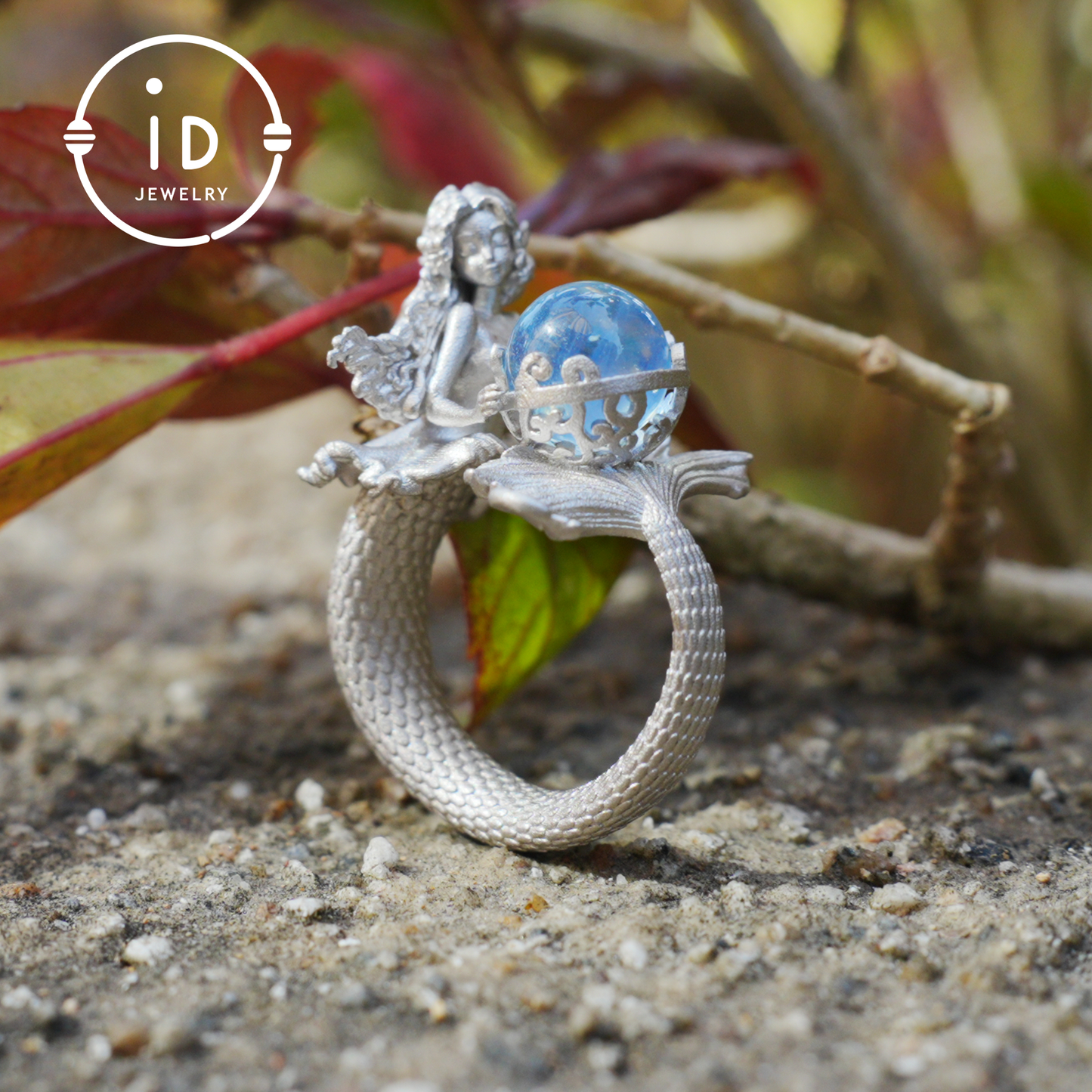 Handmade silver ring with seated mermaid and aquamarine stone, symbolic fantasy jewelry gift for women and ocean-inspired fairytale lovers