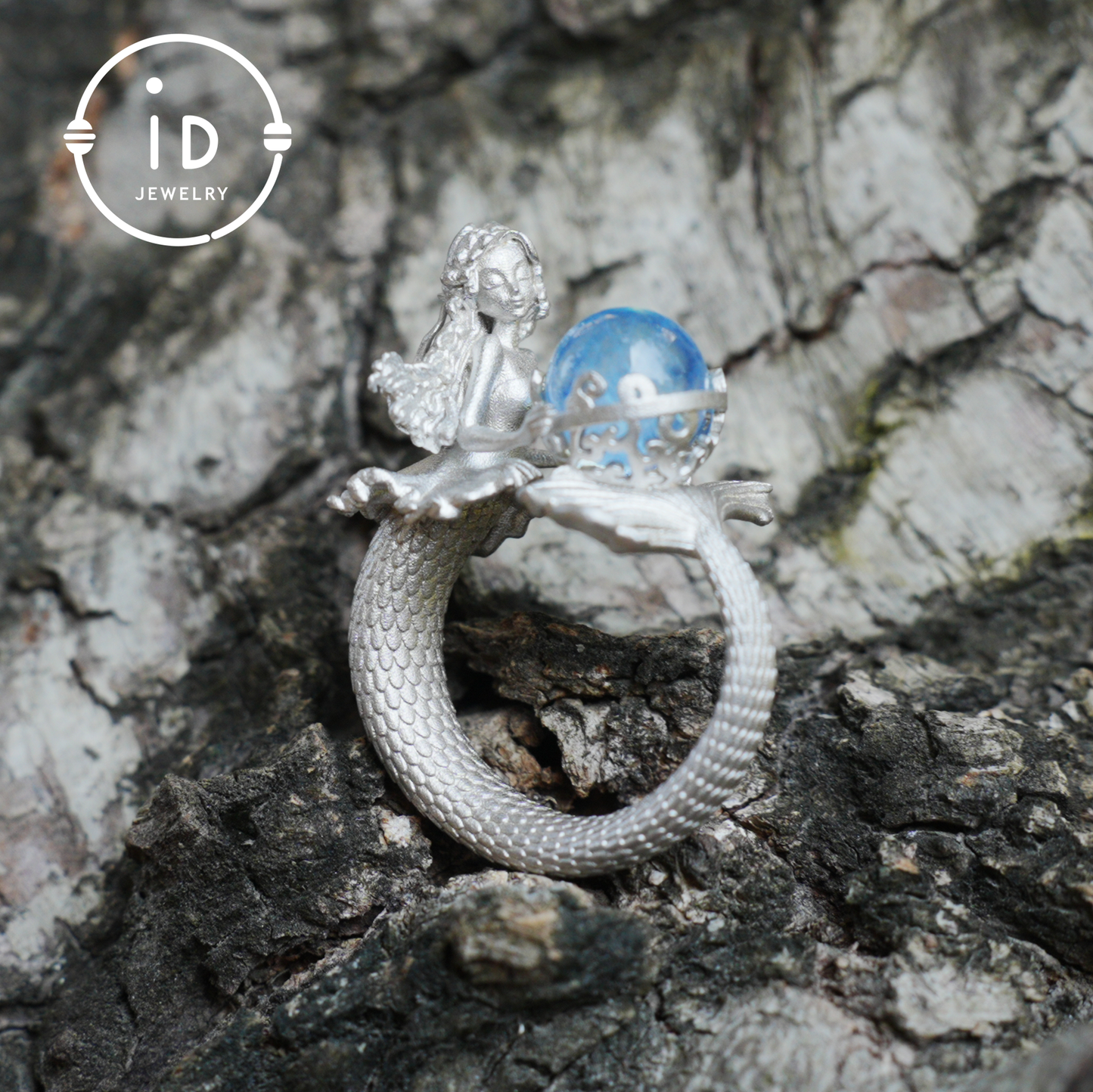 Handmade silver ring with seated mermaid and aquamarine stone, symbolic fantasy jewelry gift for women and ocean-inspired fairytale lovers
